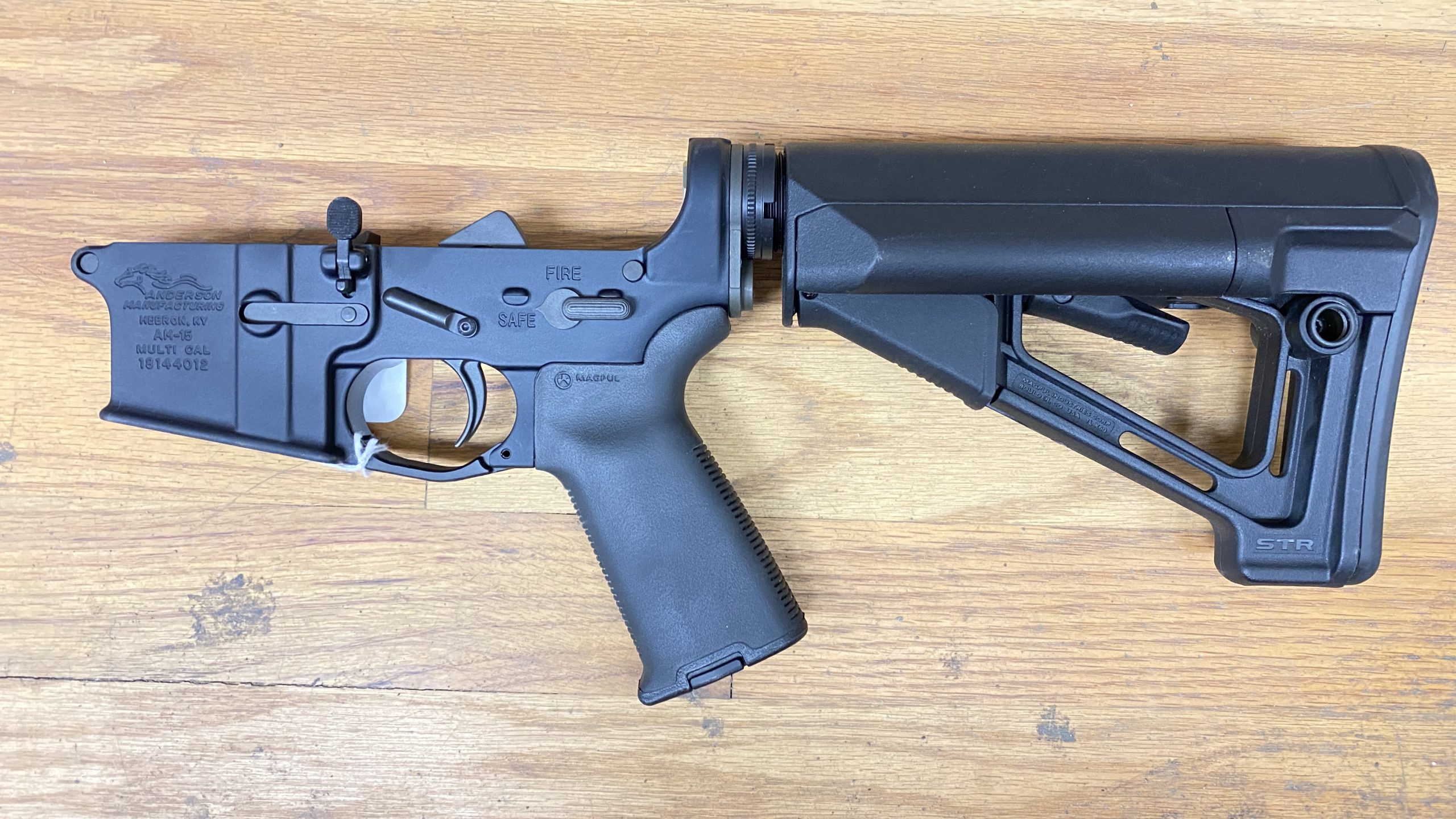 Used Anderson Manufacturing 5.56 / 223 AM-15 complete lower Magpul grip + stock